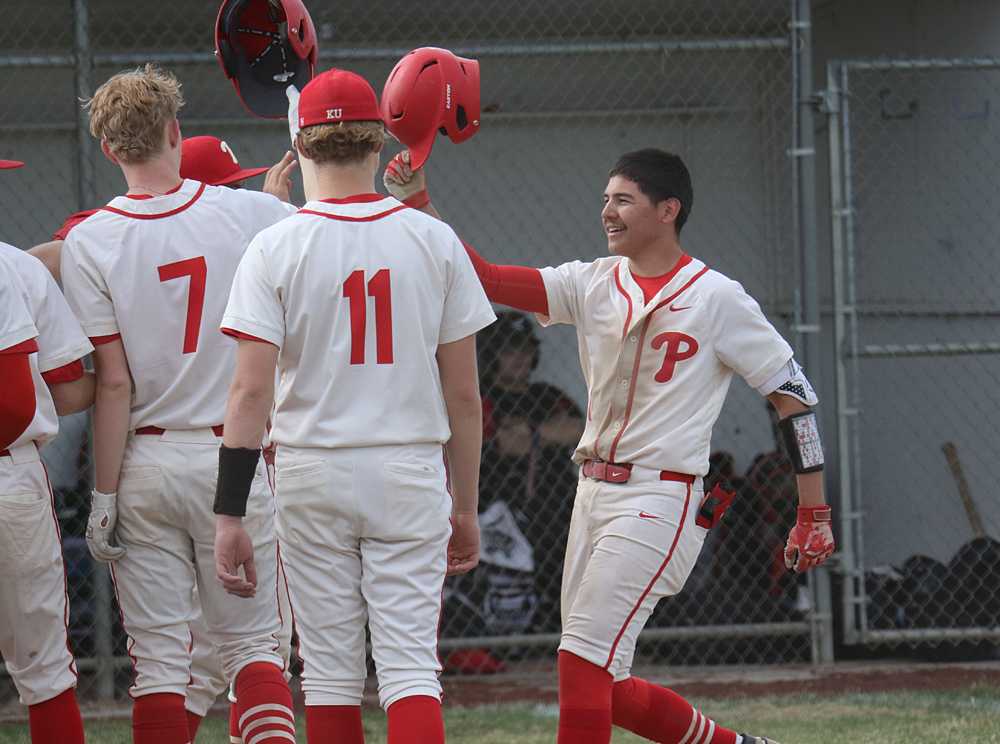 Klamath Union's Tildon Coffman (right) had a monster weekend in Madras at the White Buffalo Classic