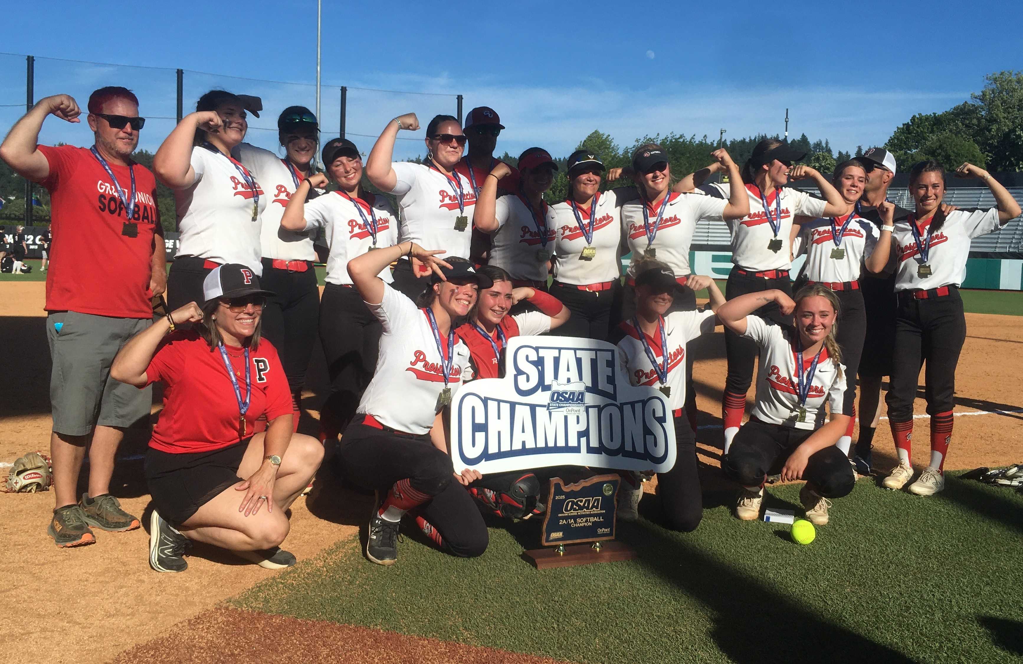 Grant Union/Prairie City players celebrate their championship win over Weston-McEwen/Griswold in Friday's 2A/1A final.