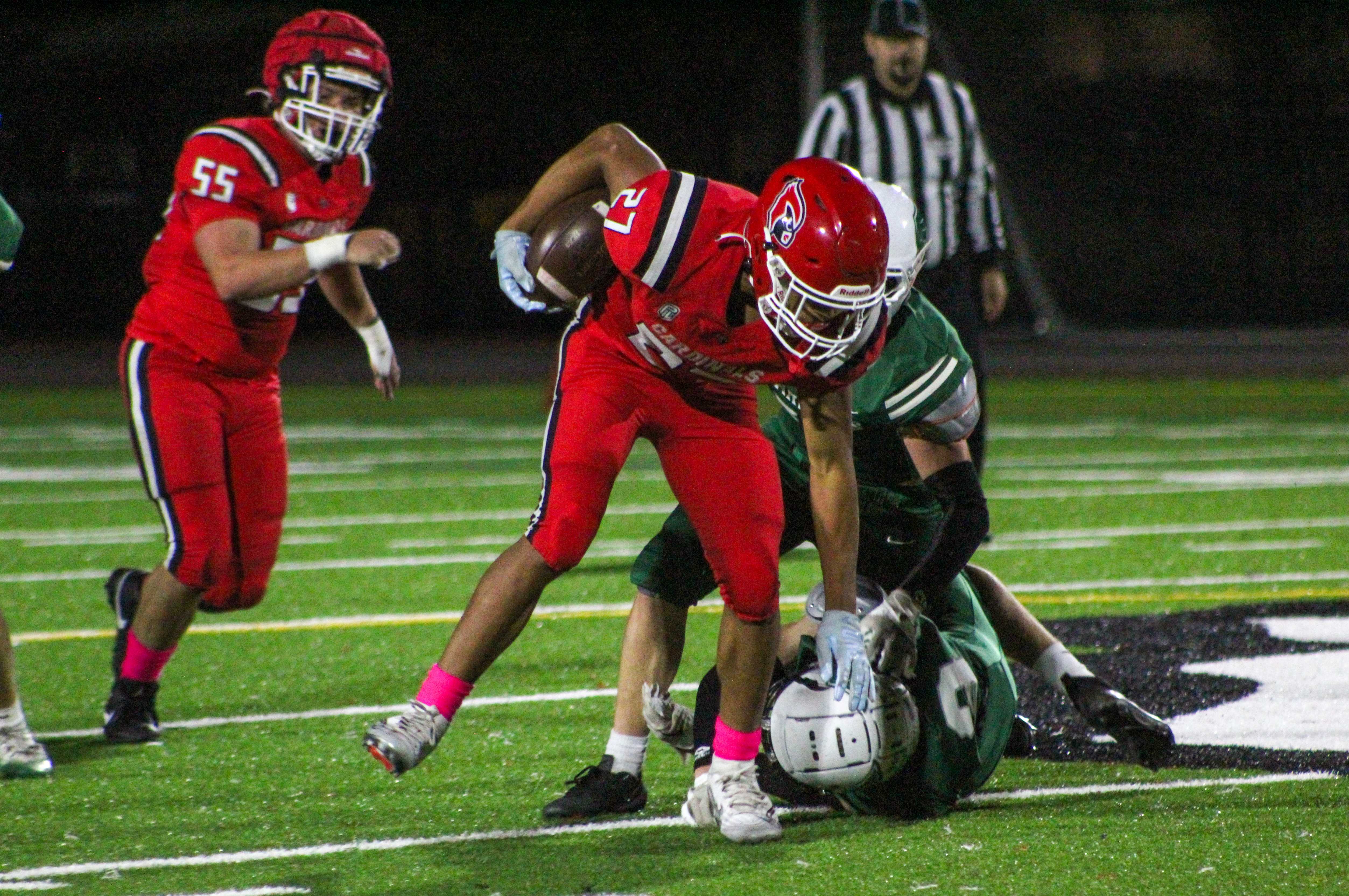 Lincoln junior Greyson Murff runs through a Wells defender in a 54-38 win. (Photo by Austin White/Portland Preps)