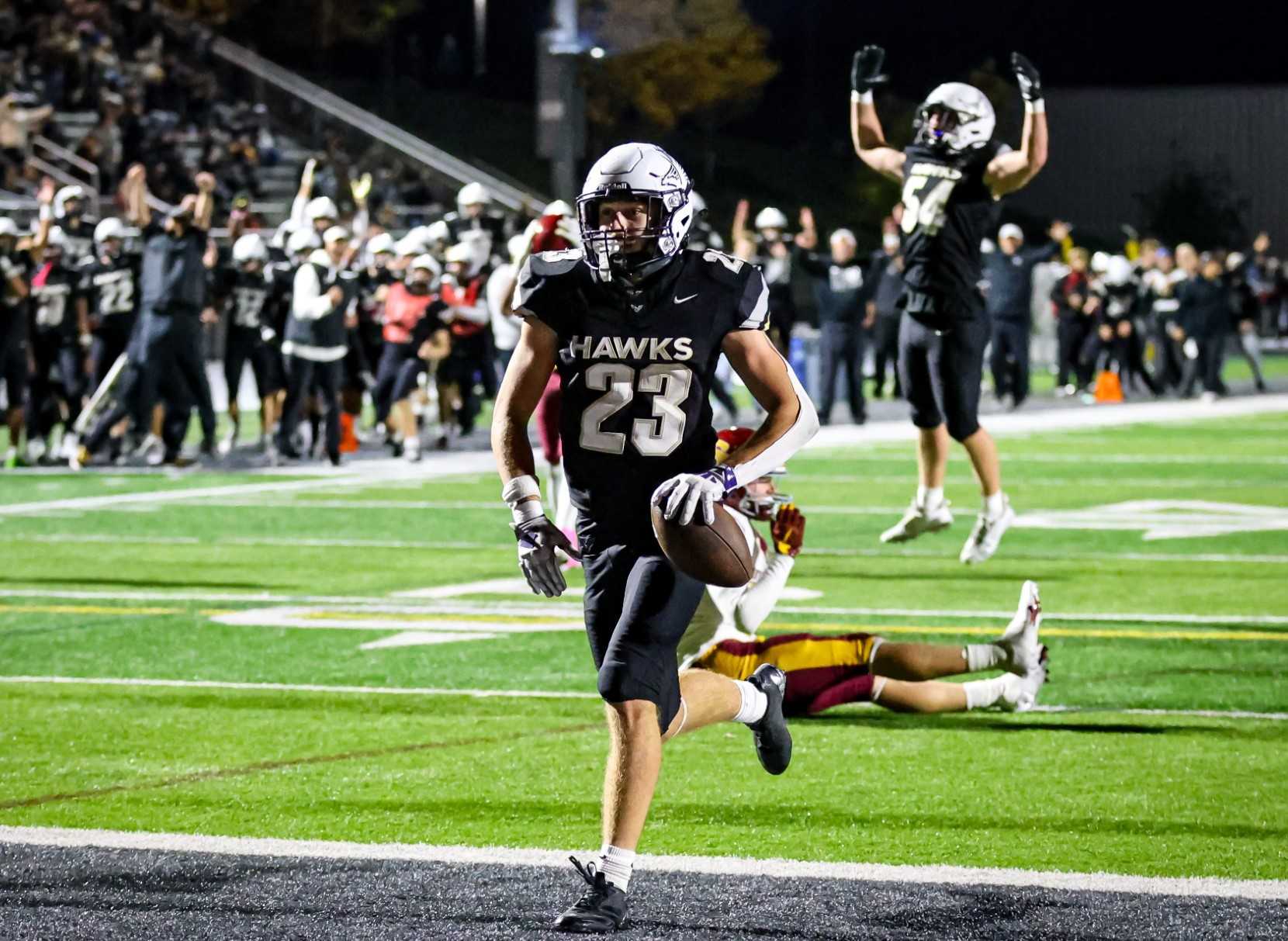 Nelson's Corbin Croslin runs for a 15-yard touchdown in the fourth quarter of his team's 26-6 win Friday. (Photo by Ryan Fanger)