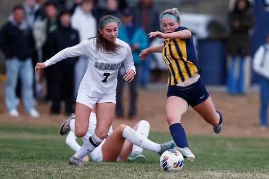 Bend's Shea Manfredi (right), working against Summit's Adeline Mitchell, has 21 goals and 13 assists. (Joe Kline/Bend Bulletin)