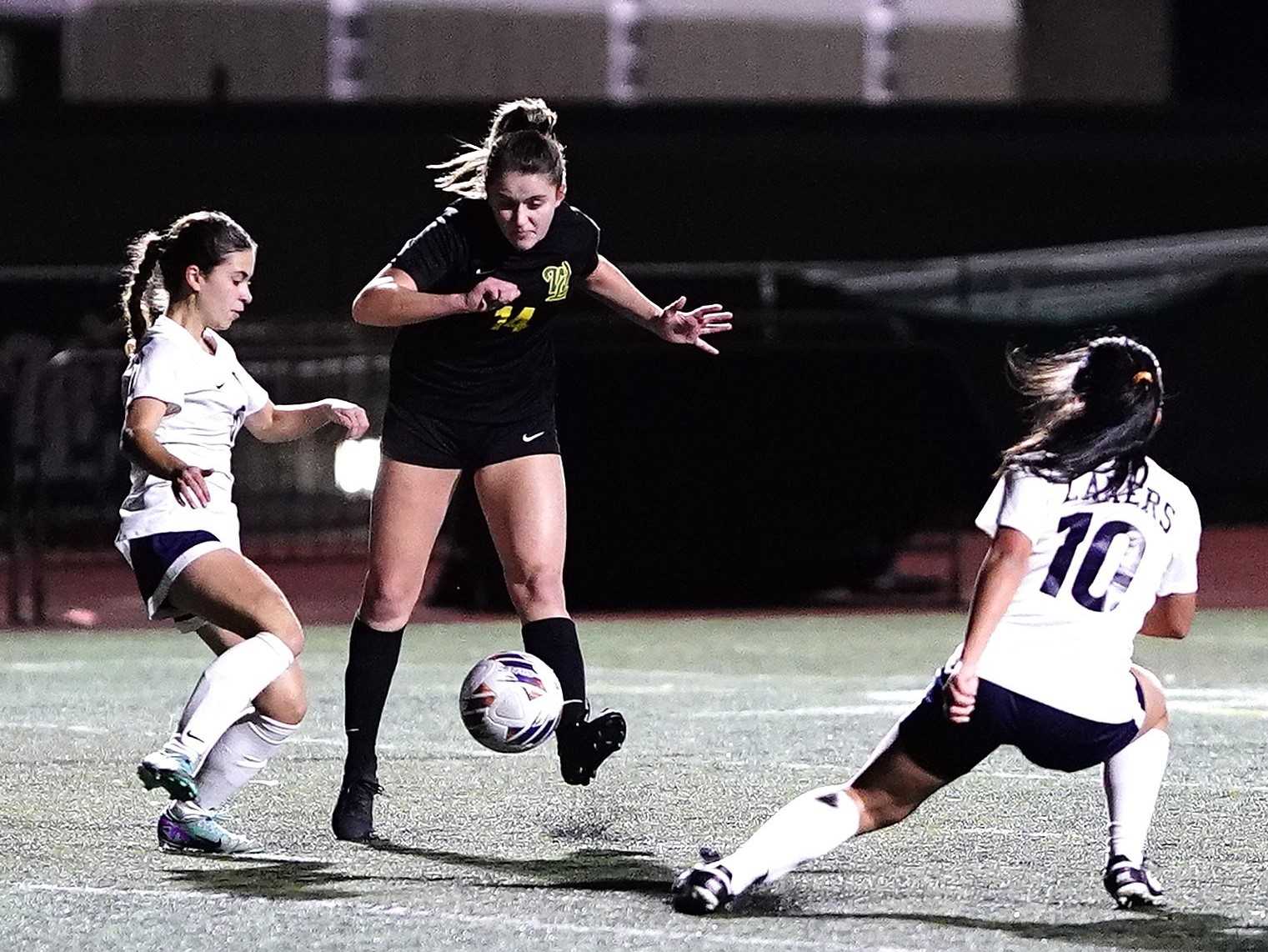 West Linn's Ellis Highland scores one of her two goals in Saturday's quarterfinal win over Lake Oswego. (Photo by J.R. Olson)
