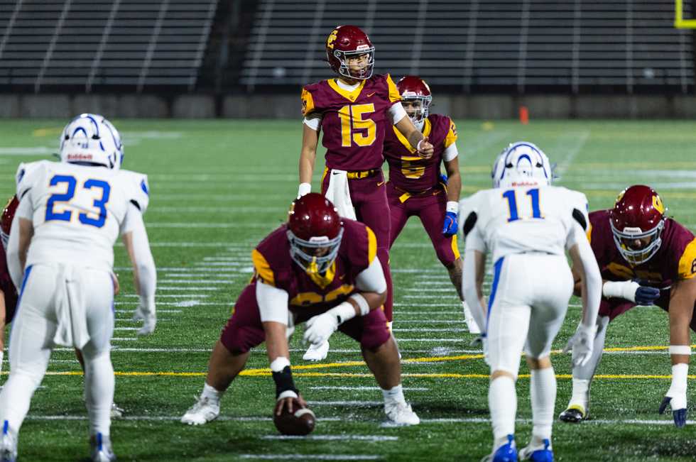 Central Catholic QB Robbie Long surveys the field against Newberg. (Photo by Ben Teese/Portland Preps)