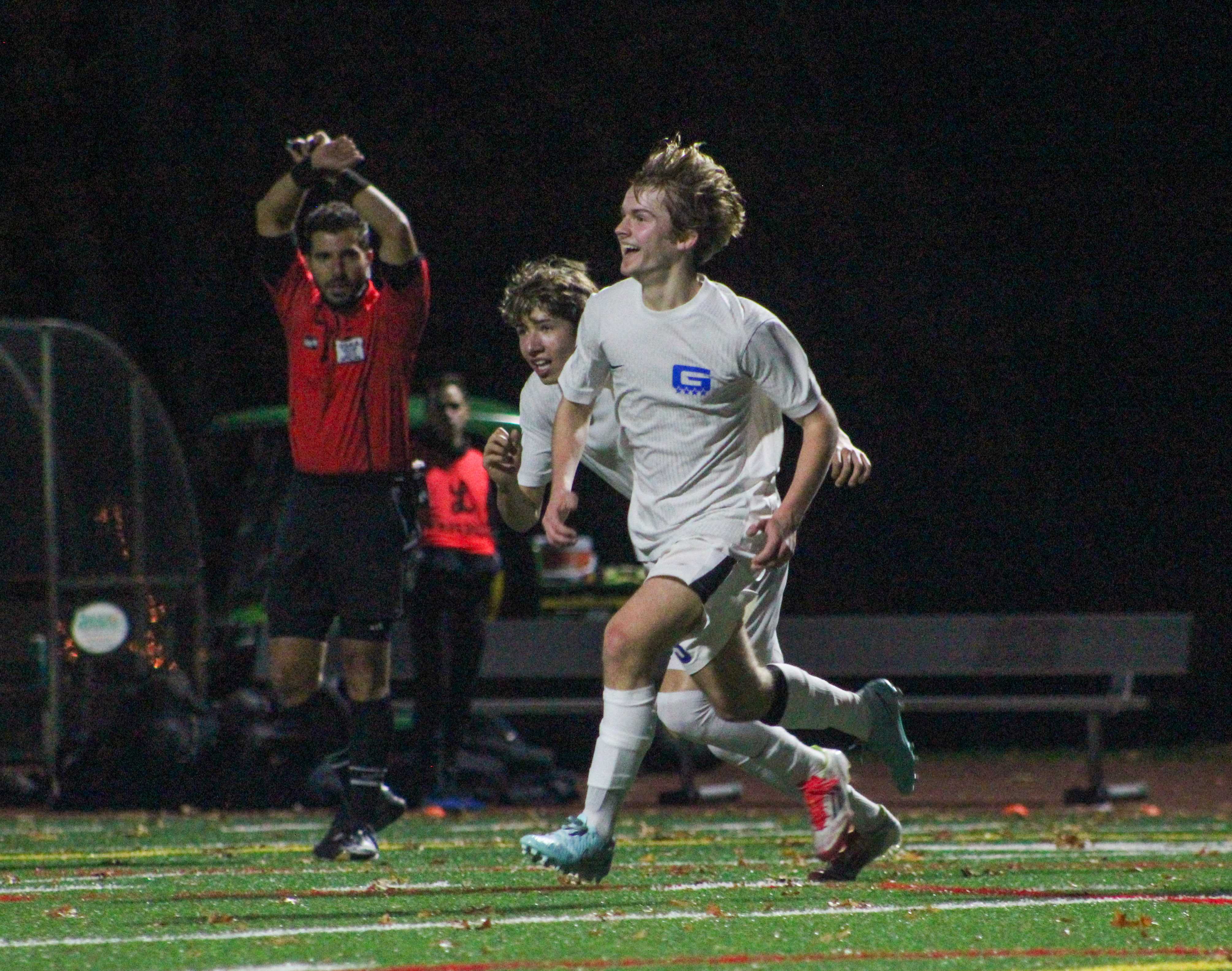 Grant boys soccer's Henry Wines celebrates after scoring a goal against Lakeridge. (Photo by Austin White)