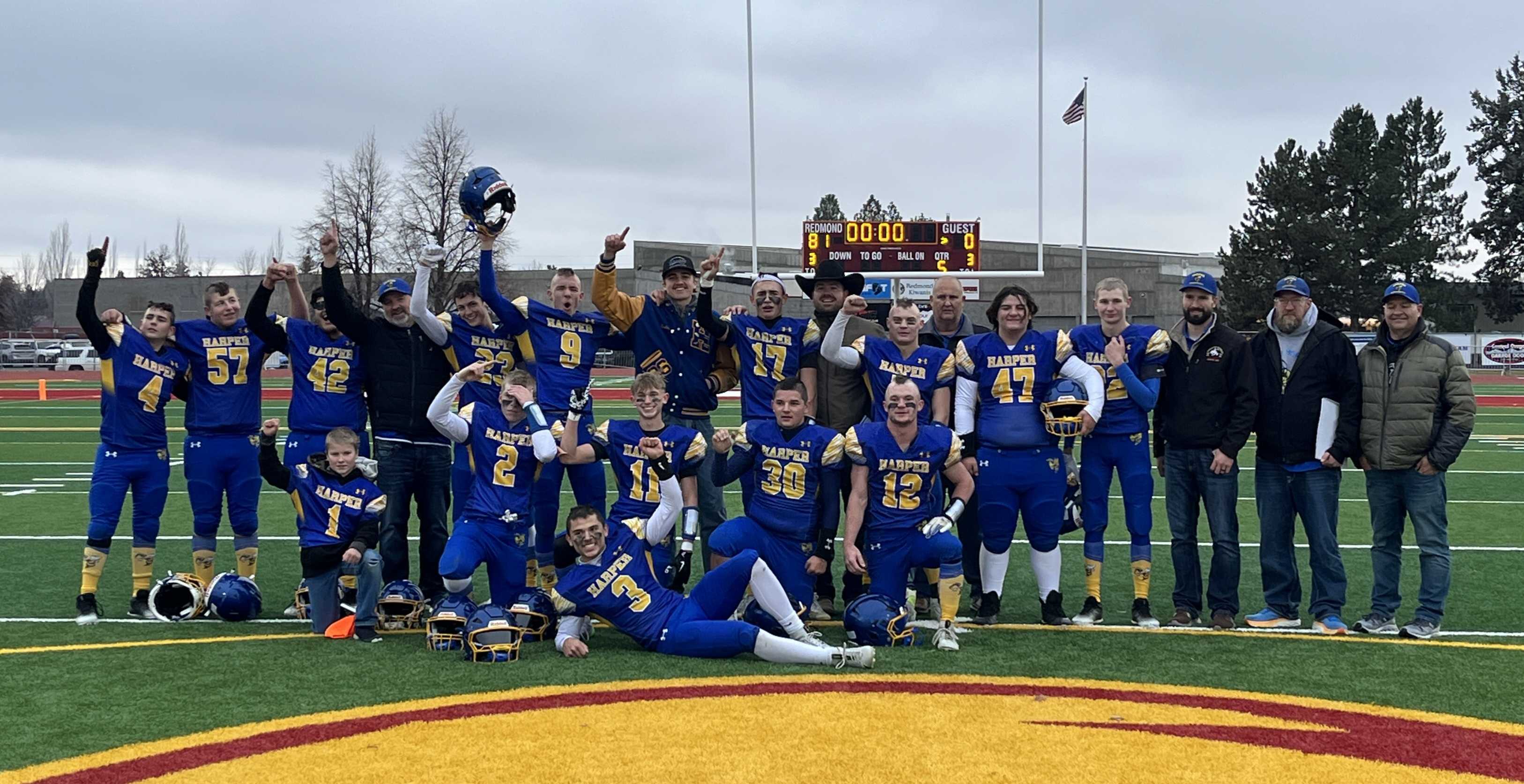 The Harper Charter football team celebrates after winning the 1A 6-man state title. (Photo by Missy Smith)