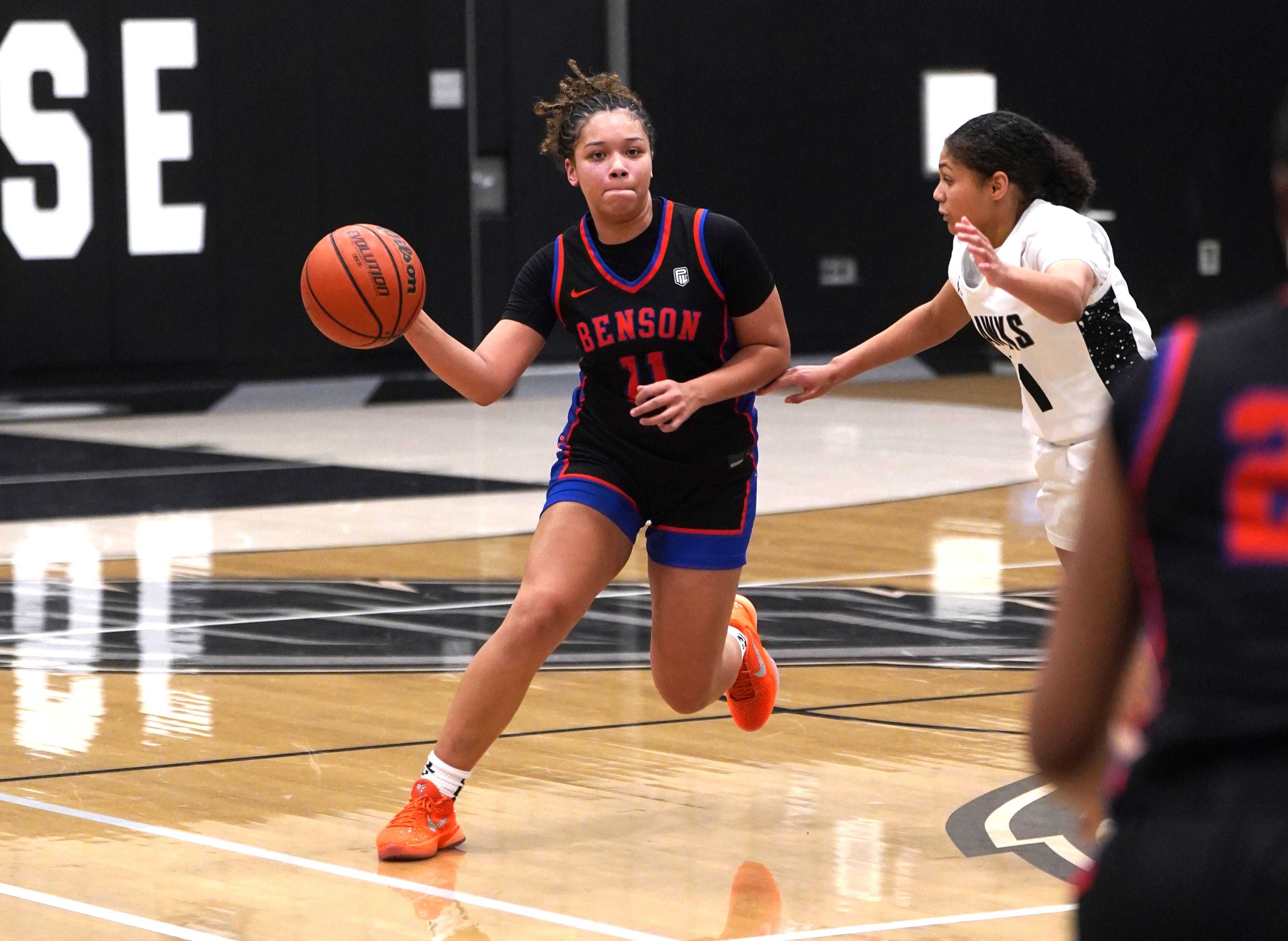 Benson sophomore point guard Kemara Phillips (11) works around Nelson's defense in Friday's game.(Photo by Fanta Mithmeuangneua)