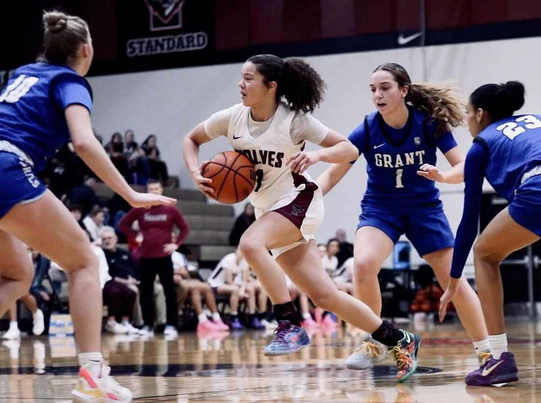 Tualatin point guard Love Lei Best drives through the Grant defense in Tuesday's nonleague win. (Ryan Slider/SS Visual Works)