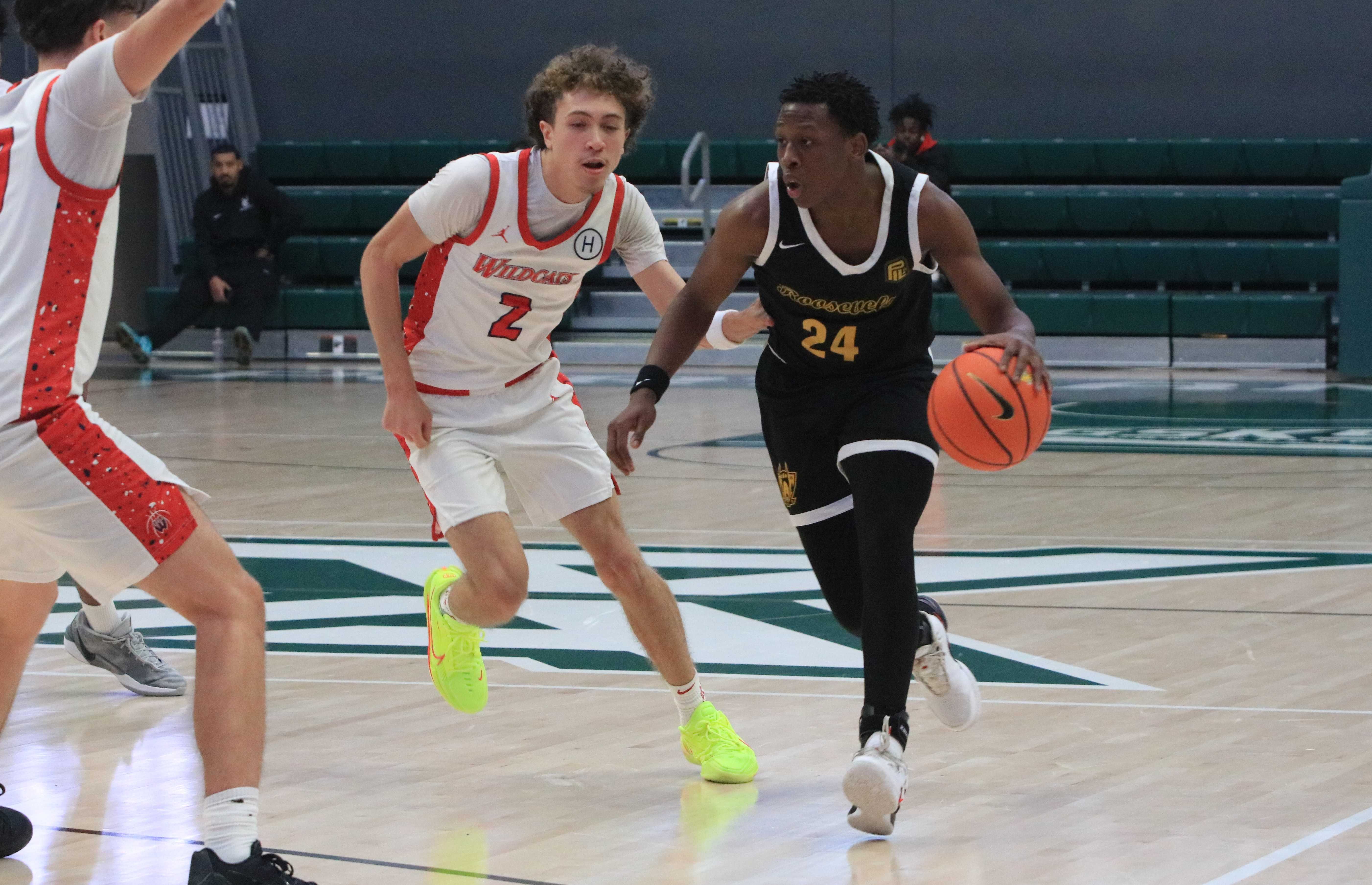 Roosevelt's Jayden Metcalf (24) drives on Westview's Dayton Jenkins (2) during Friday's LSI opener at Portland State.