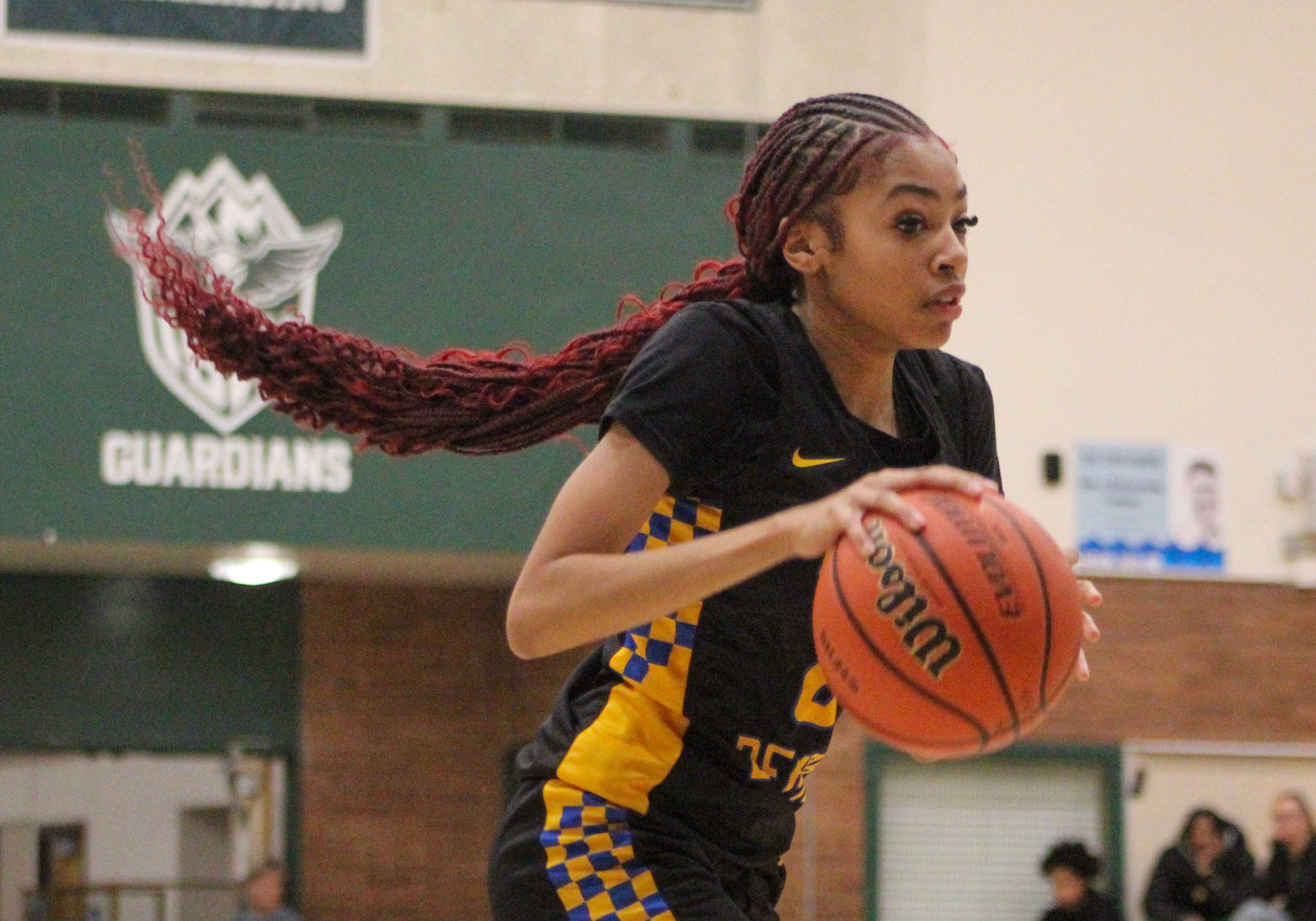 Jefferson senior Amaya Thomas dribbles the ball against Ida B. Wells. (Photo by Austin White/Portland Preps)