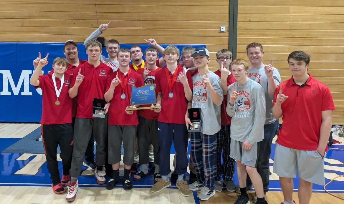 The Union/Cove boys wrestling team poses with the unofficial 1A state title trophy. (Photo from Joe Shaw)
