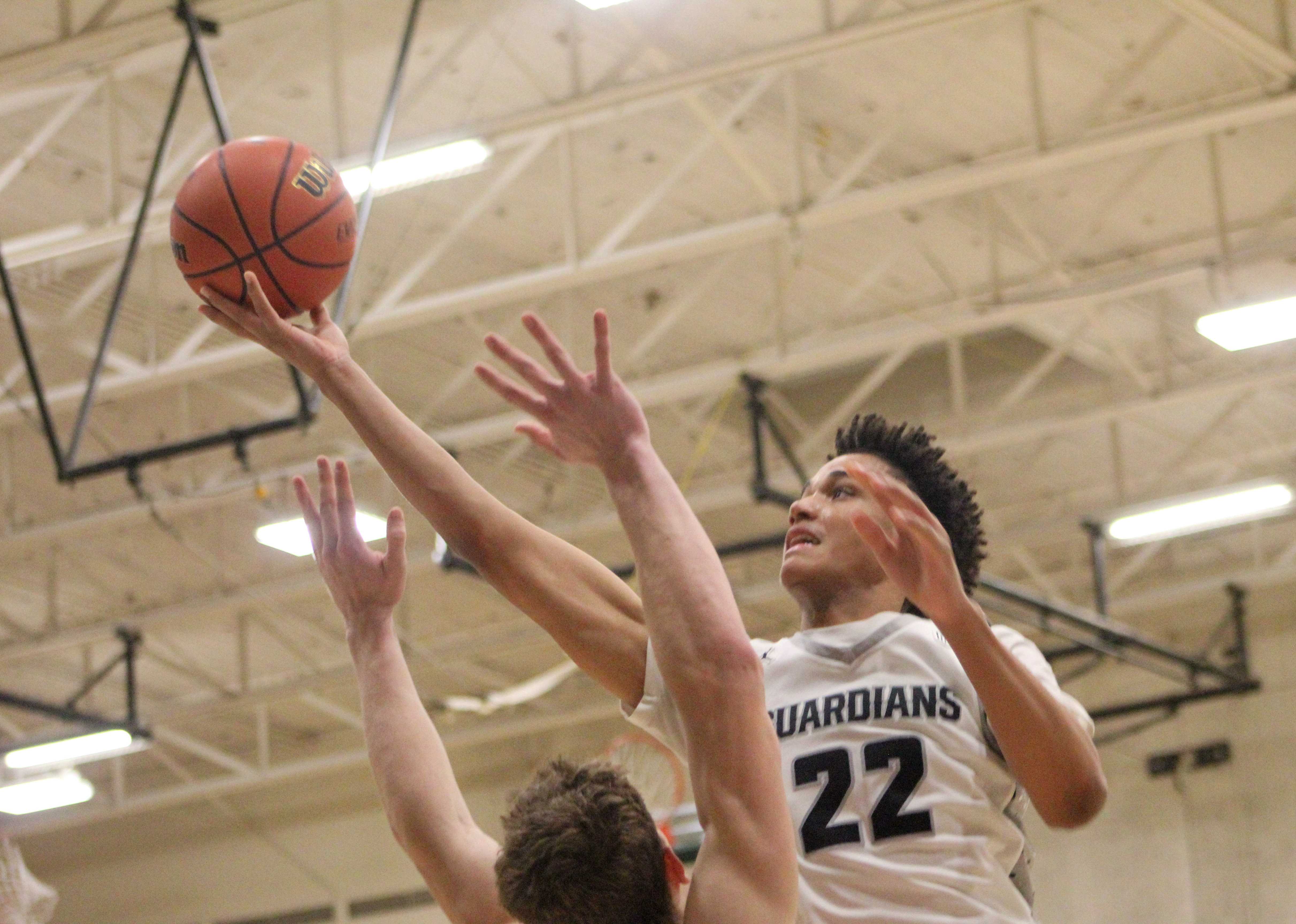 Wells junior Muhammed Carter goes up for a layup against Lincoln. (Photo by Austin White/Portland Preps)