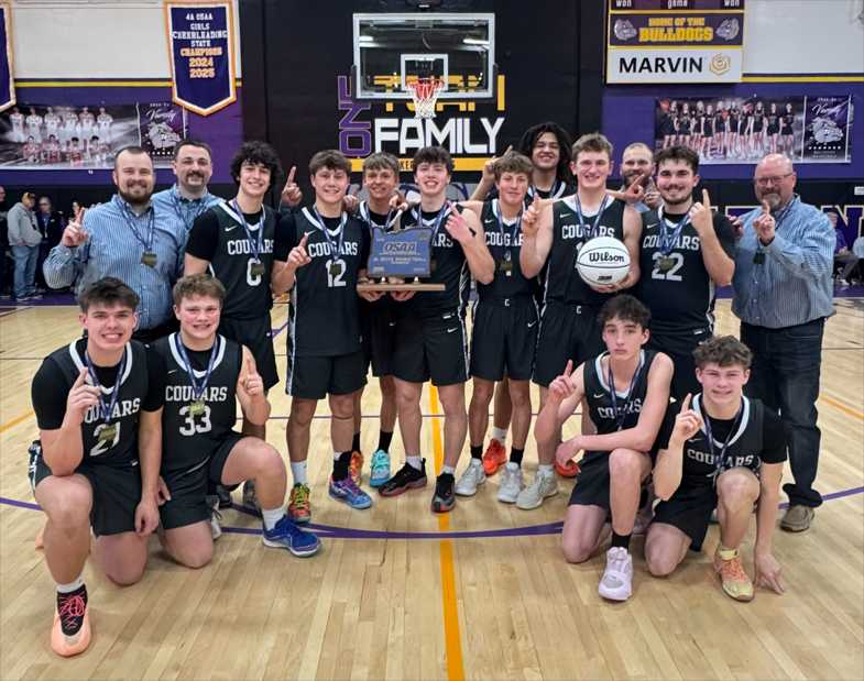 The Country Christian boys basketball team poses with the 1A state title trophy