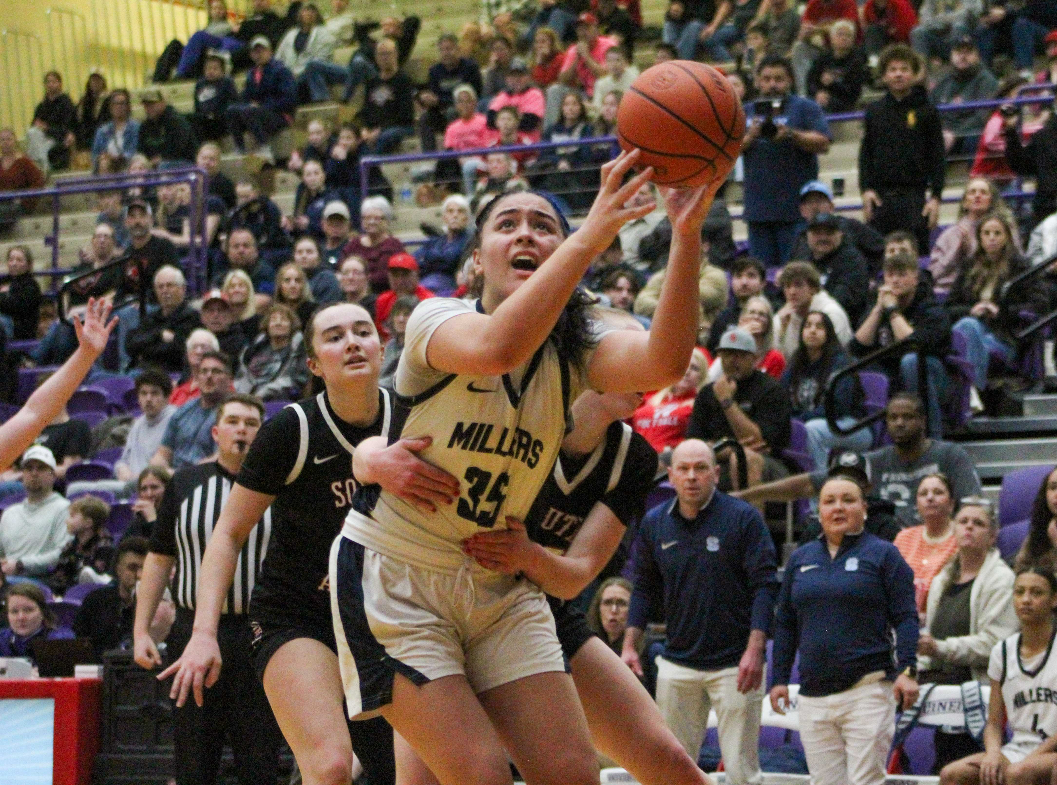 Springfield freshman Nuari Filipe throws up a shot through contact in the 5A semifinals. (Photo by Austin White)