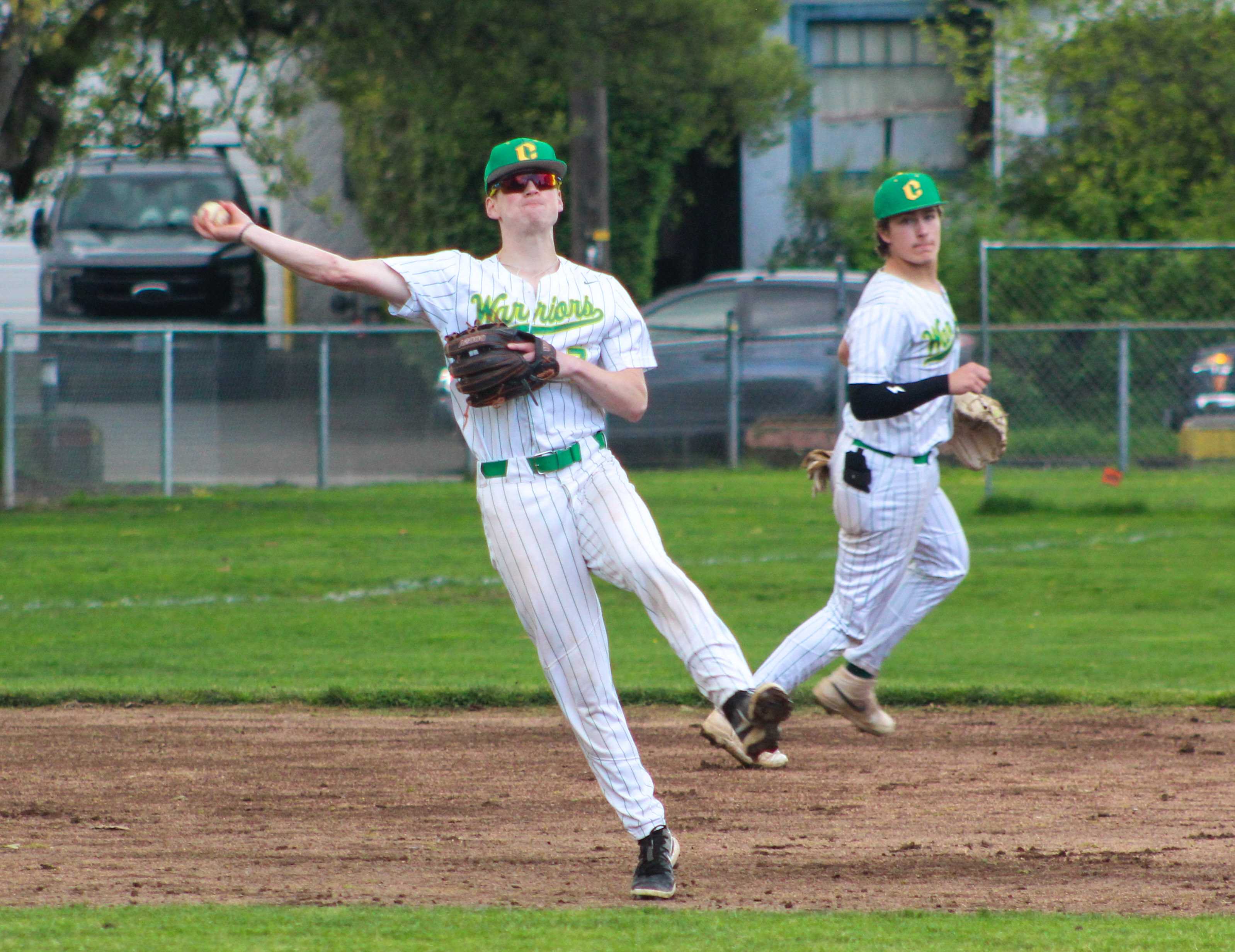Cleveland shortstop Arlo Oetting makes a throw to first against Jefferson. (Photo by Austin White/Portland Preps)