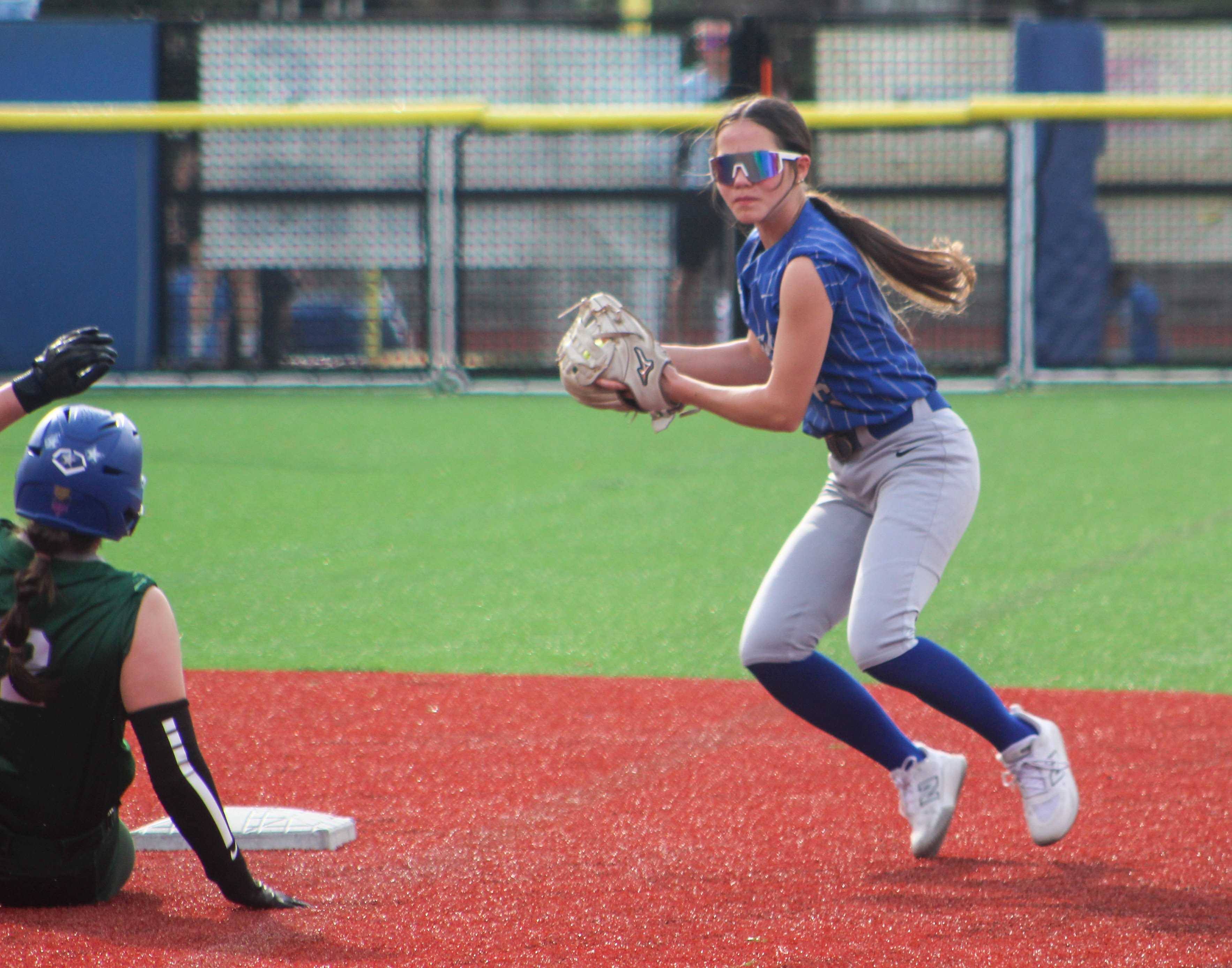 Grant's Anya Rumage looks to turn a double play against Wells. (Photo by Austin White/Portland Preps)