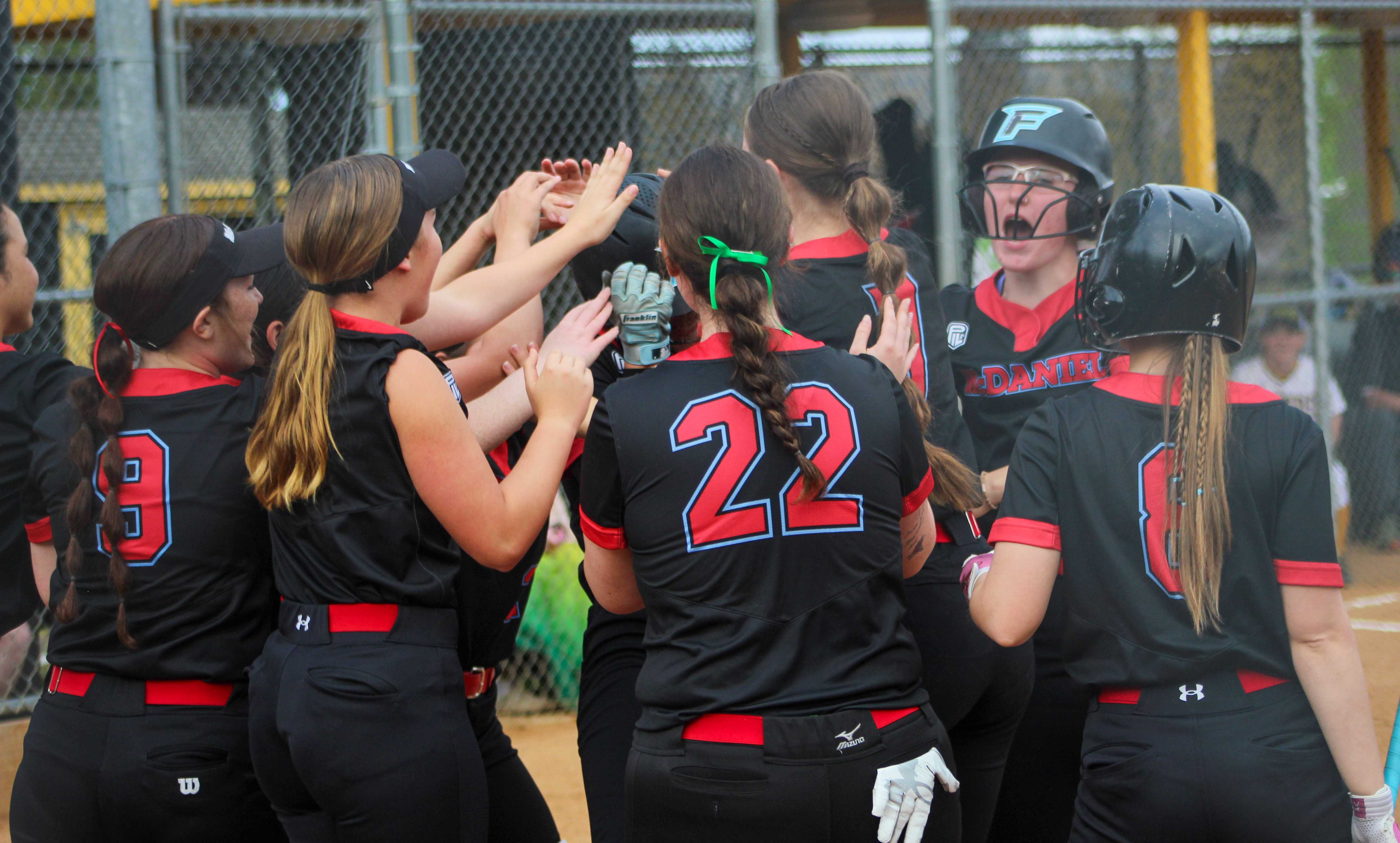 McDaniel players celebrate a home run from Lucy Anderson against Roosevelt. (Photo by Austin White/Portland Preps)