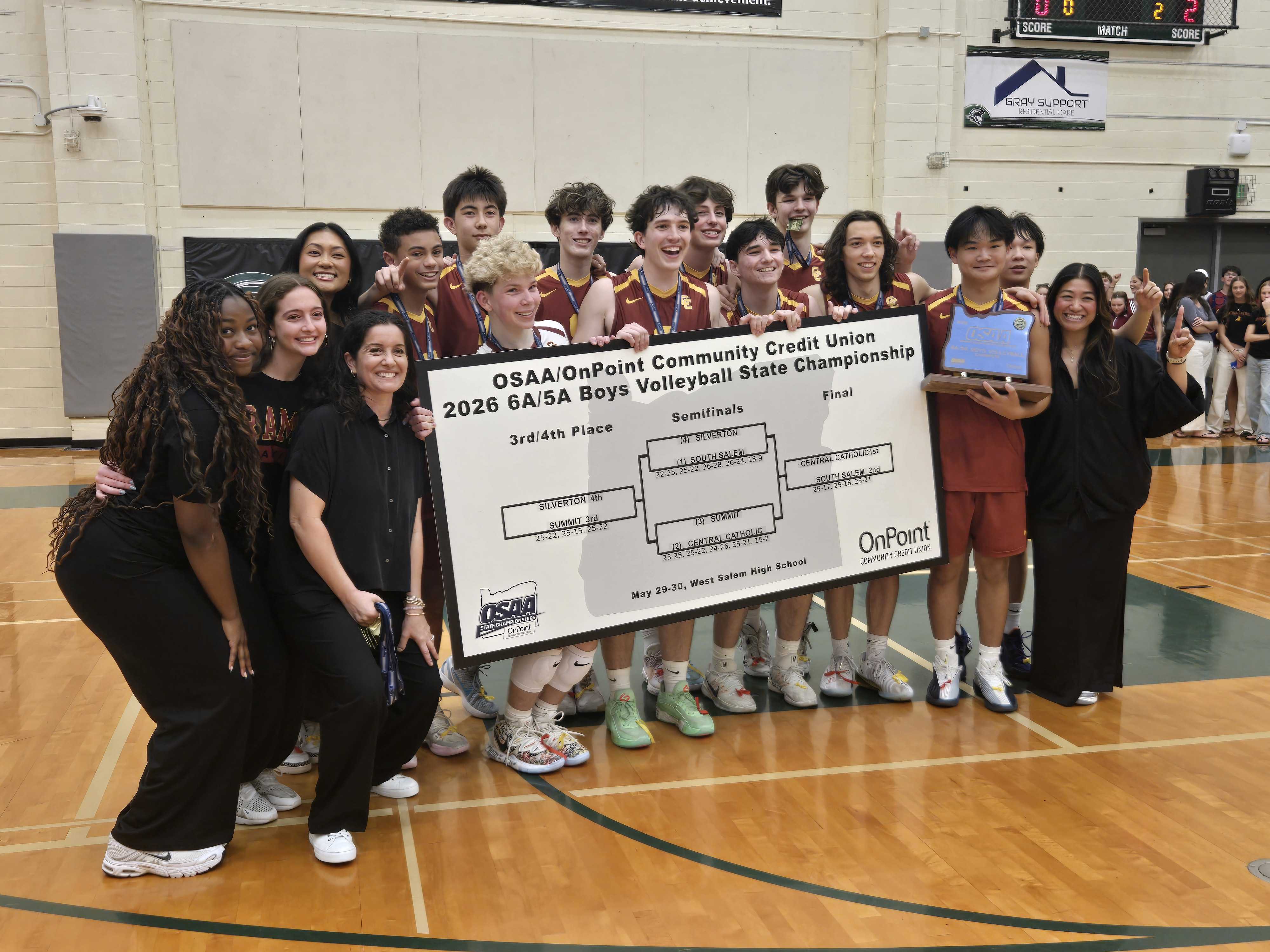 The Central Catholic boys volleyball team poses with the state championship trophy. (Photo by Austin White)