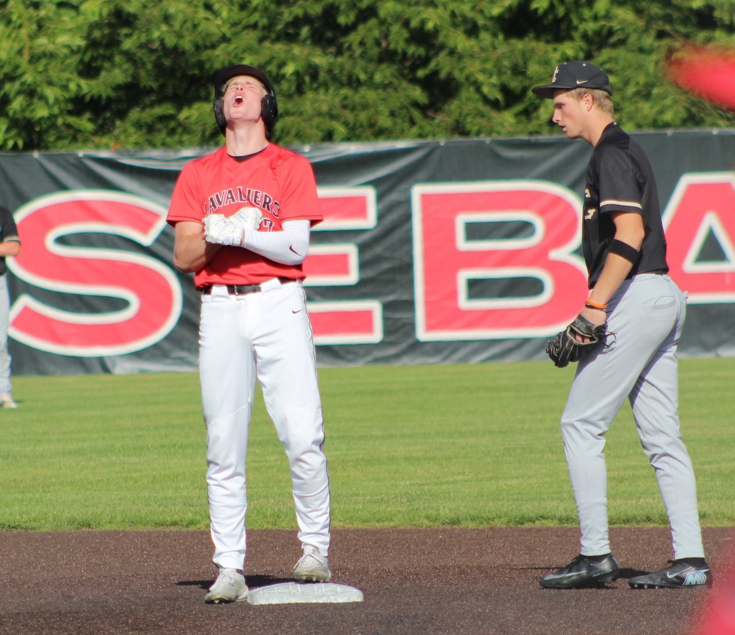 Clackamas senior Justin Larsen reacts after hitting a double in the second inning against Jesuit. (Photo by Austin White)