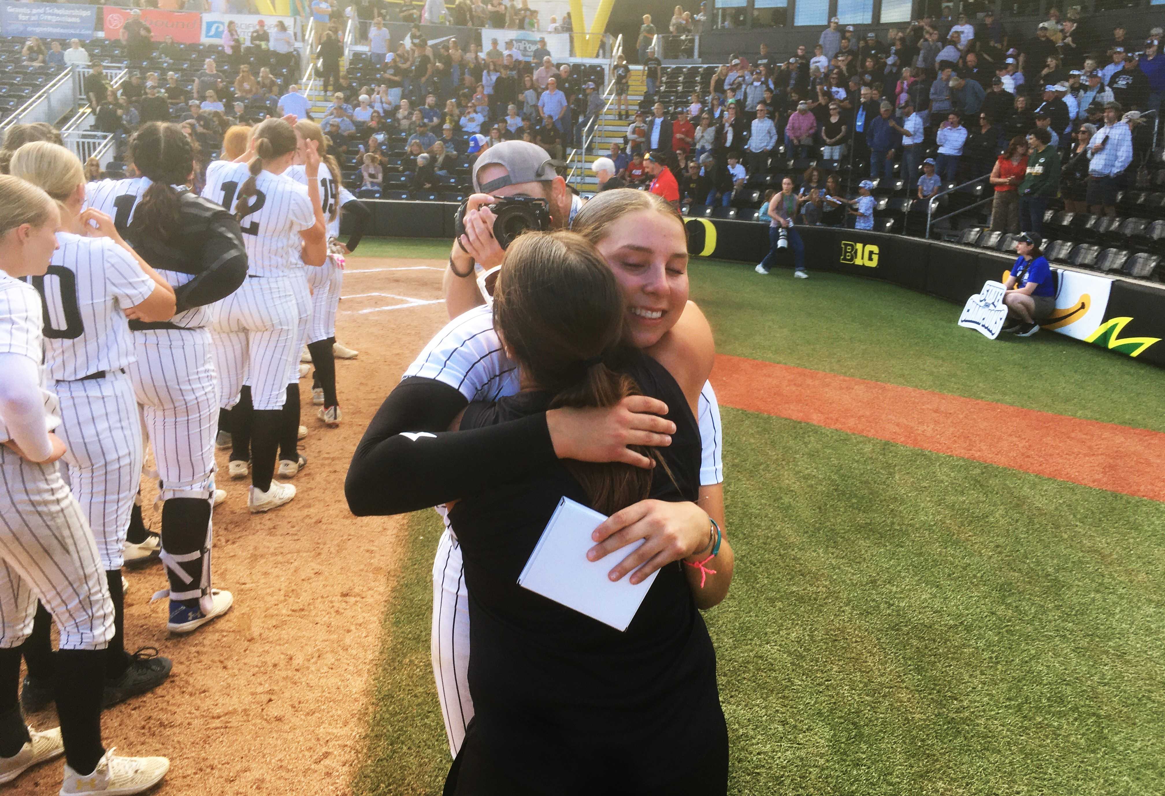 Vale pitcher Sophia Navarrete embraces coach Cirbi Morrison after the Vikings' 1-0 win over South Umpqua on Friday.