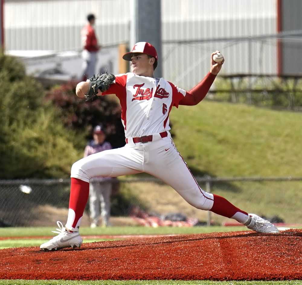 Brody Panuke dominated on the mound and drove in two for the Trojans, who won their third title in four seasons (JR Olson)